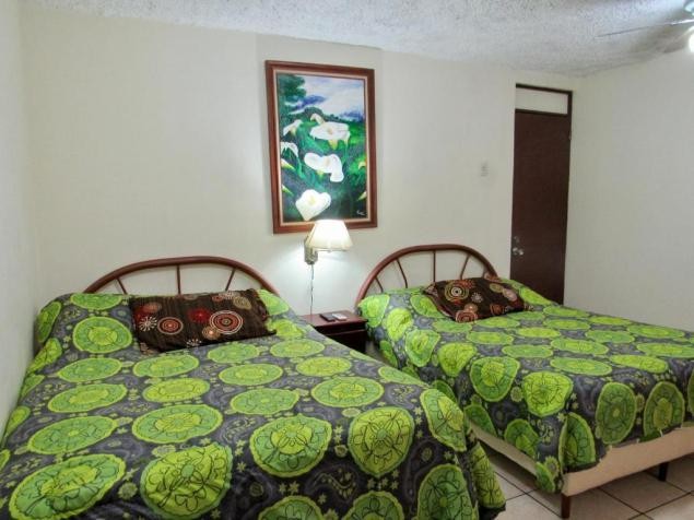 Habitación con dos camas matrimoniales